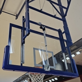 Height adjustment of basketball backboards