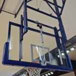 Height adjustment of basketball backboards